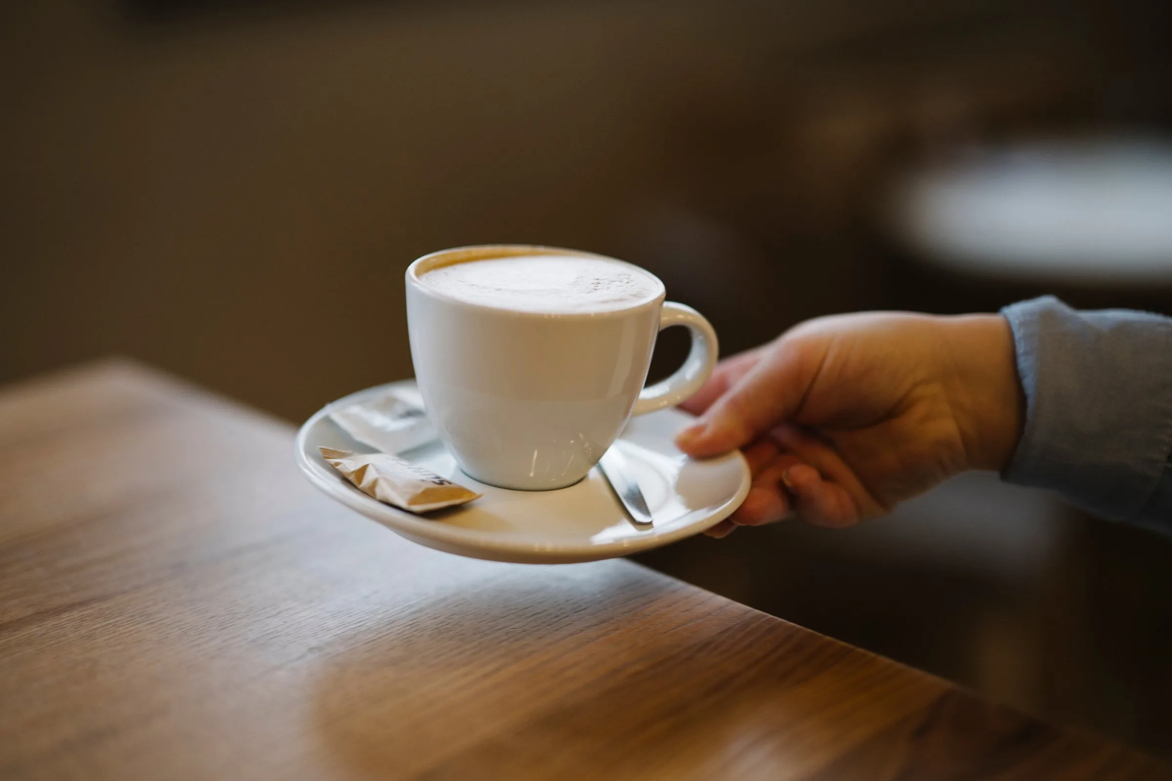 A cup of coffee at a cafe table